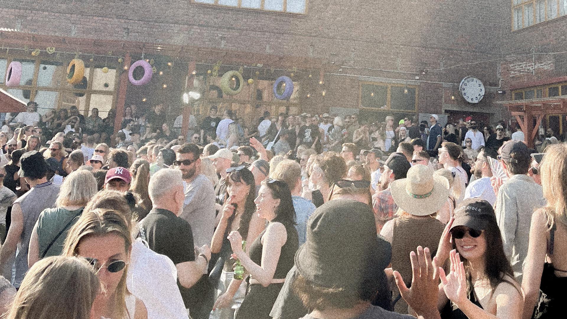 Ääniwalli photographed from the outside. On the photo, there are people outside the building.