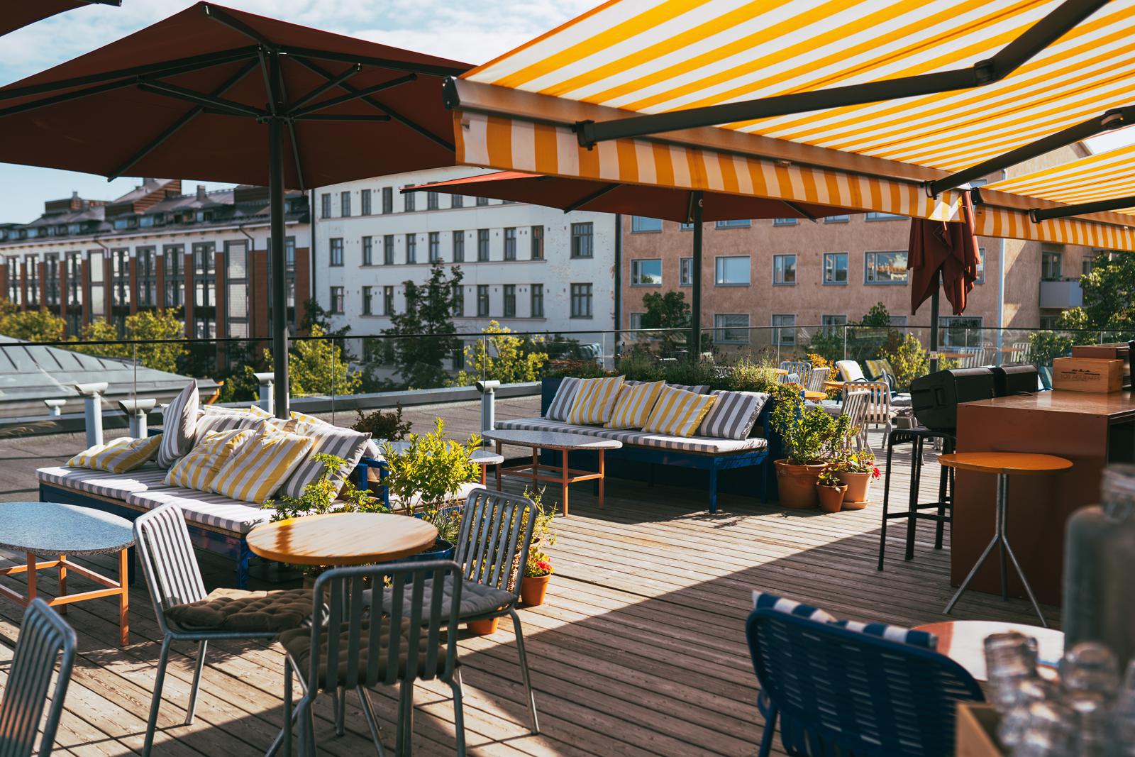 Alexis roof top bar. Chairs and tables on the outdoor terrace.