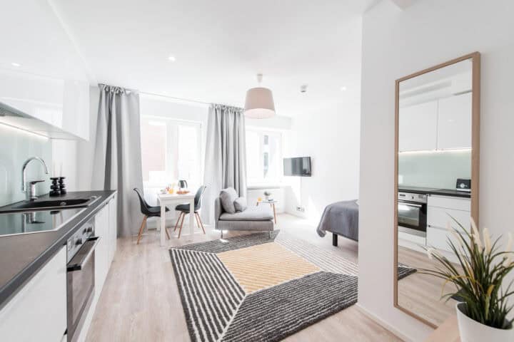 a room with a kitchen and dining area