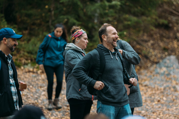 A group of people walking in the woods