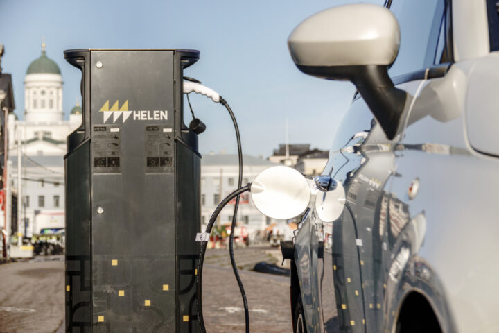 a car with an electric charging cable showing Helsinki's commitment to green hydrogen