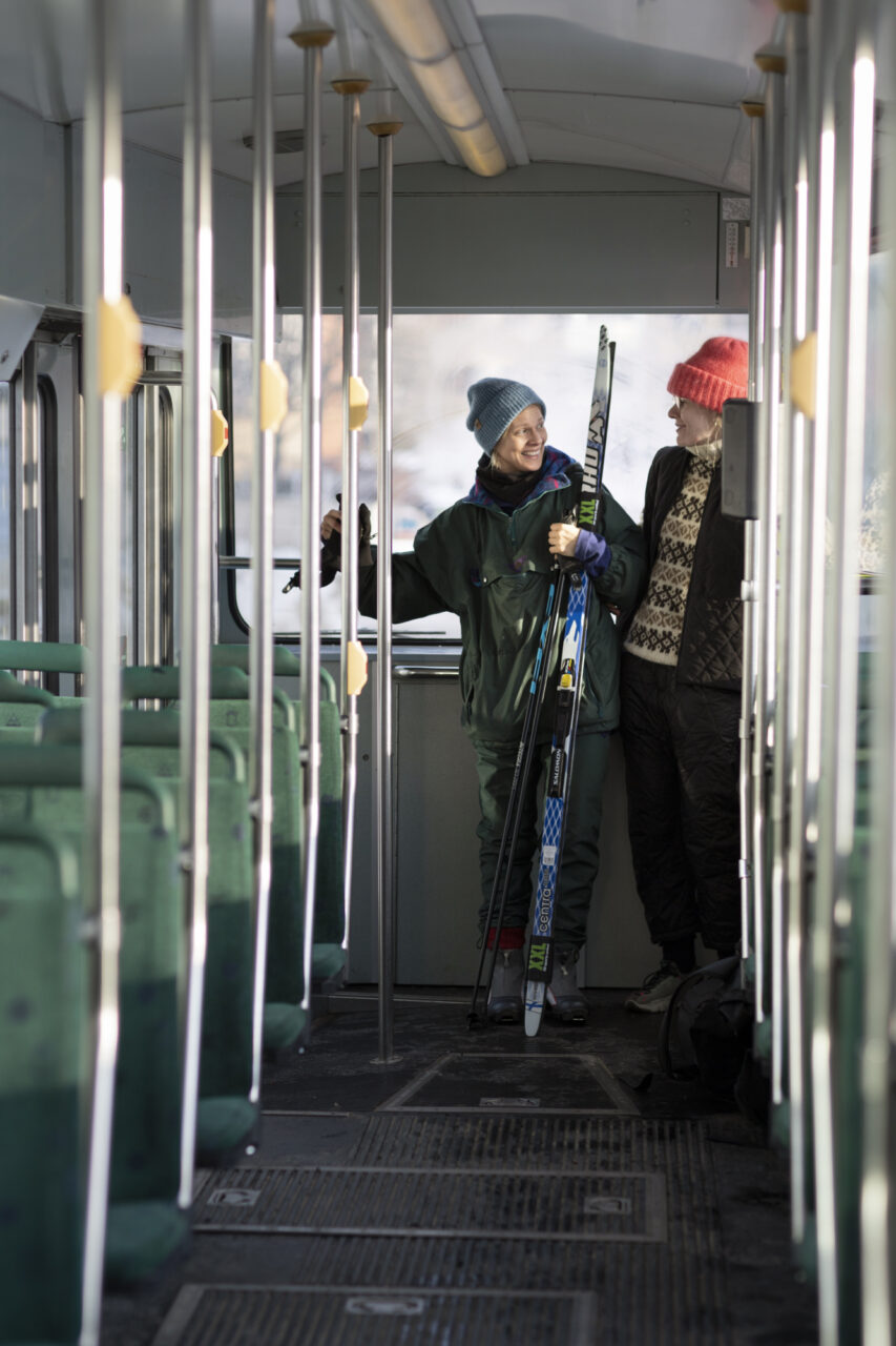Women with ski gears in tram