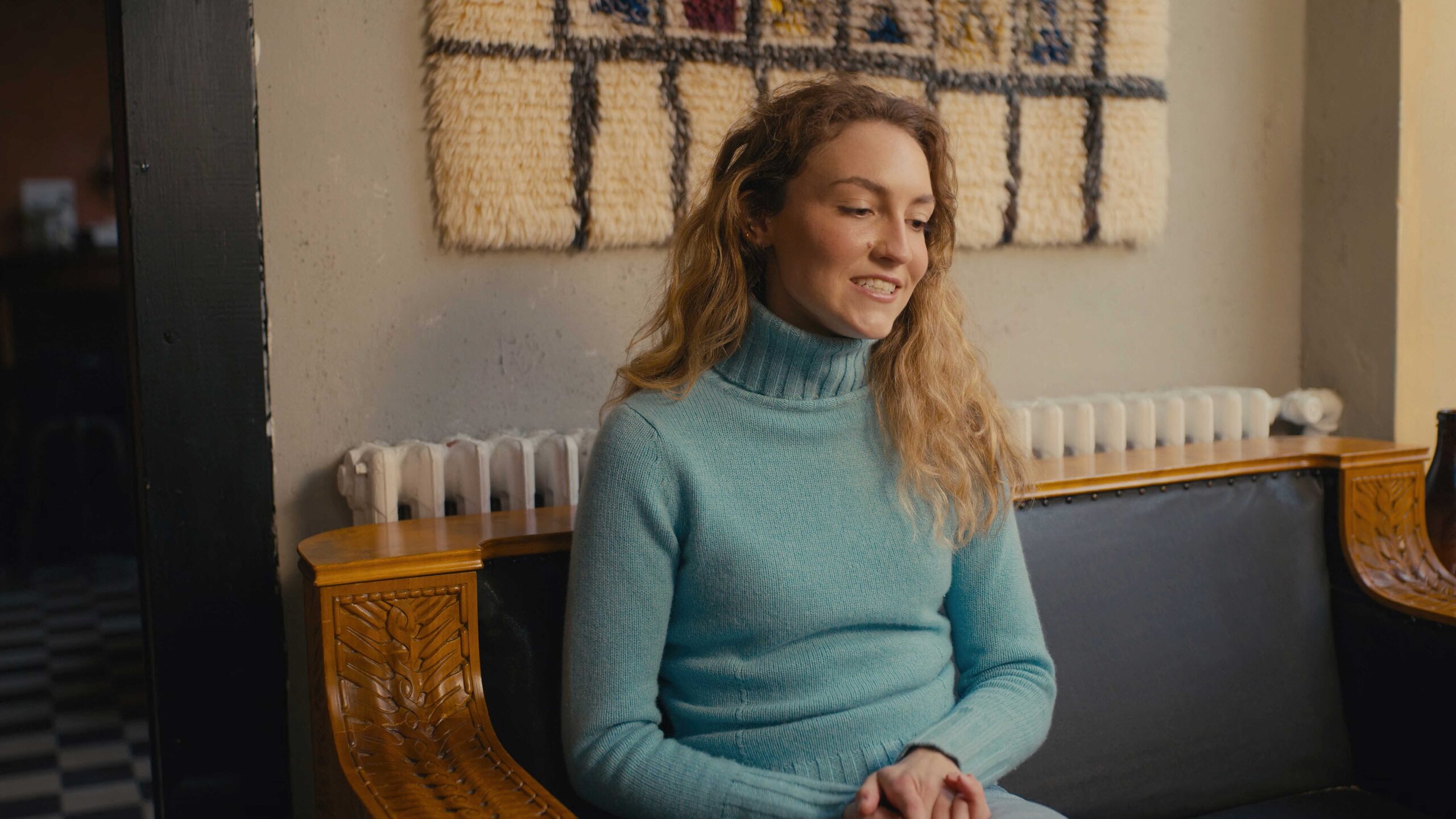 a woman sitting on a bench