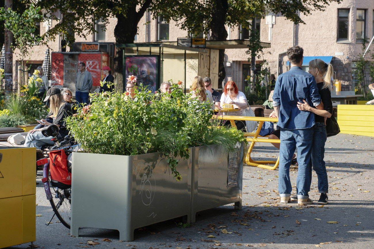 People on the summer streets of Kallio neighbourhood in Helsinki.