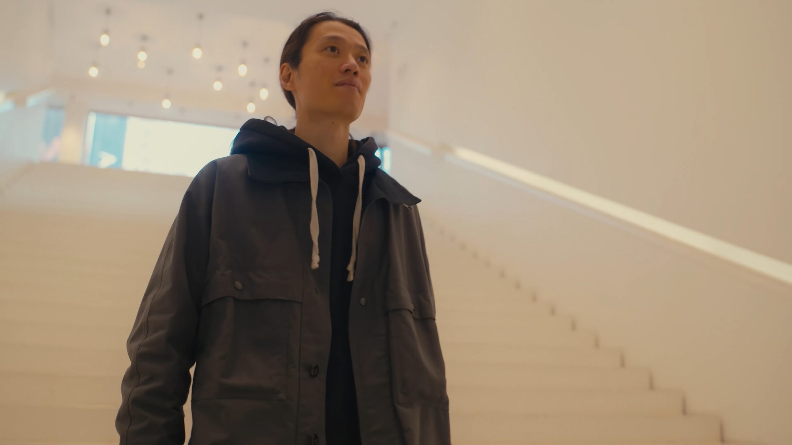 a man standing in a white room