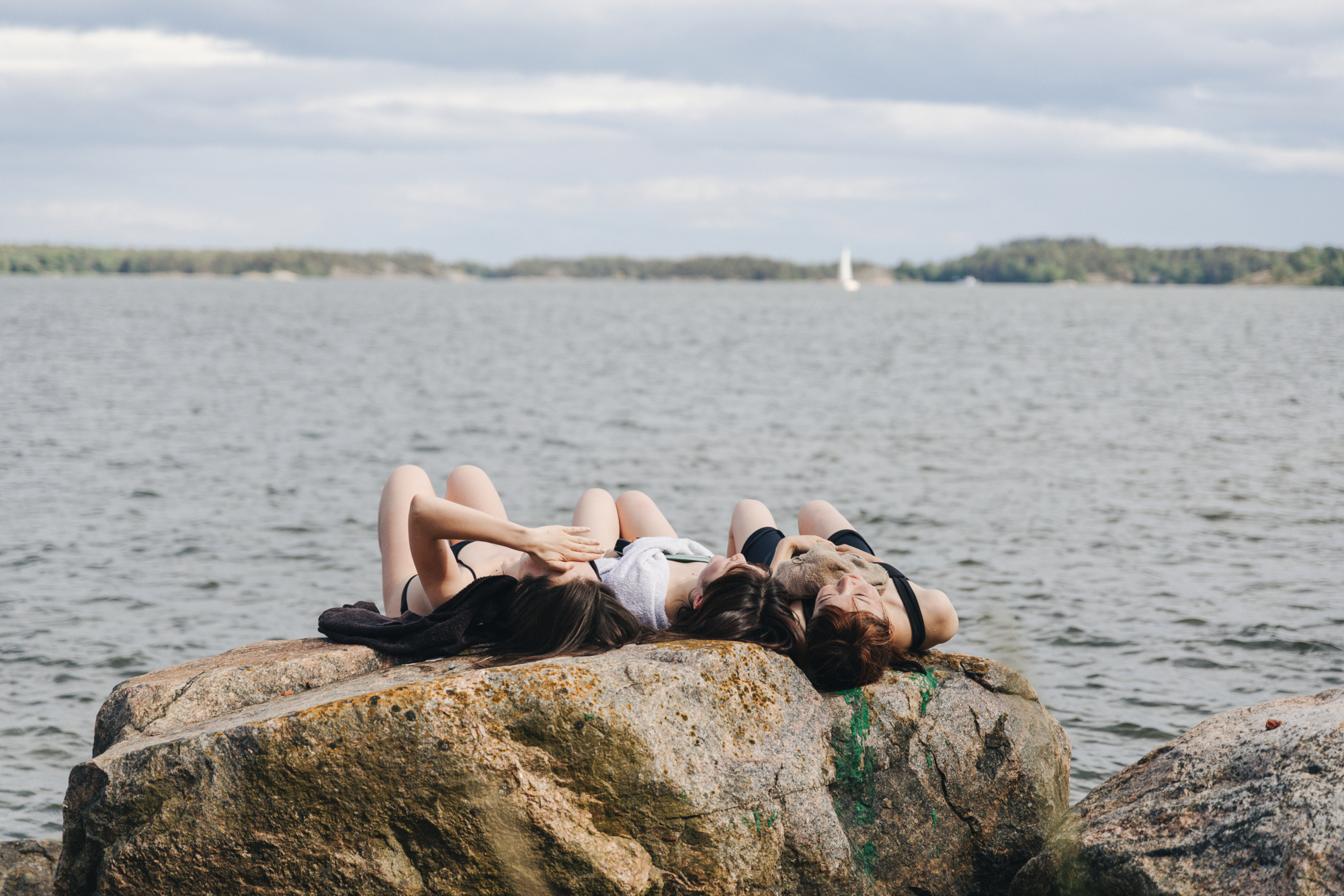 Girls sunbathing on the rocks (2)