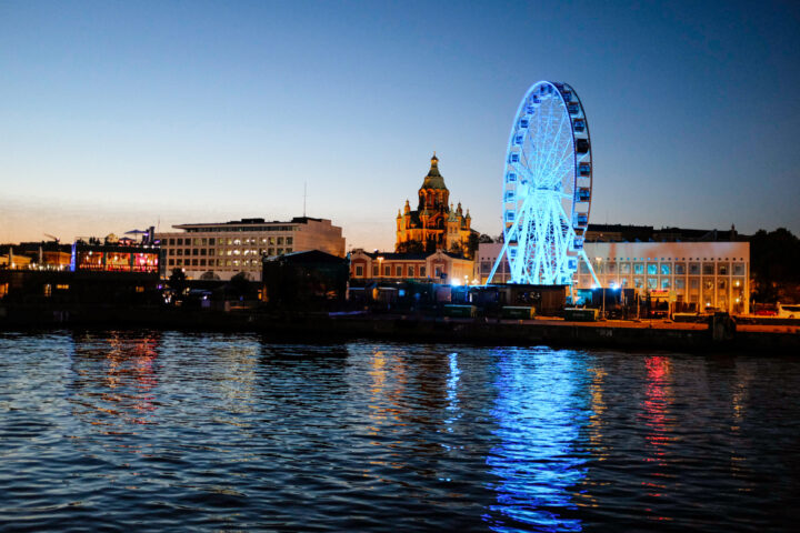 a ferris wheel lit up at night