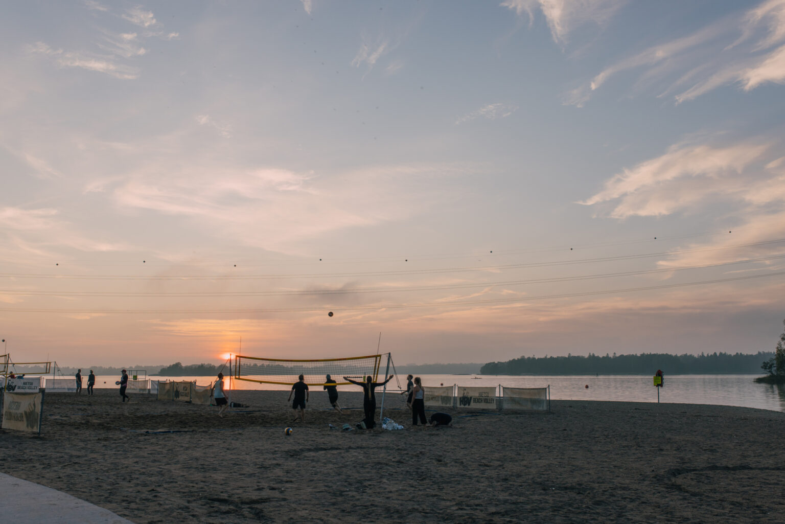 a group of people on Hietaranta Beach one of the best swimming places in Helsinki