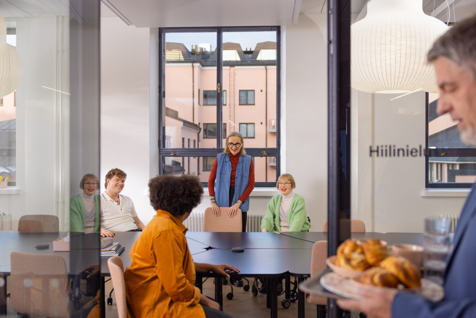 a group of people sitting around a table