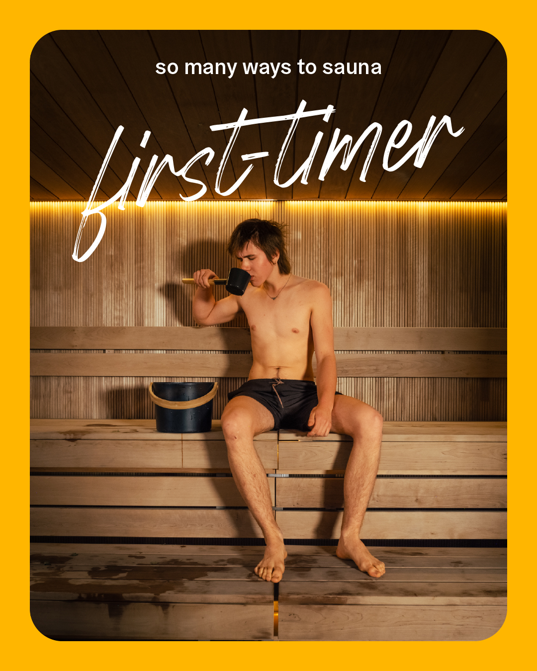 a man sitting on a bench in a sauna for the first time 
