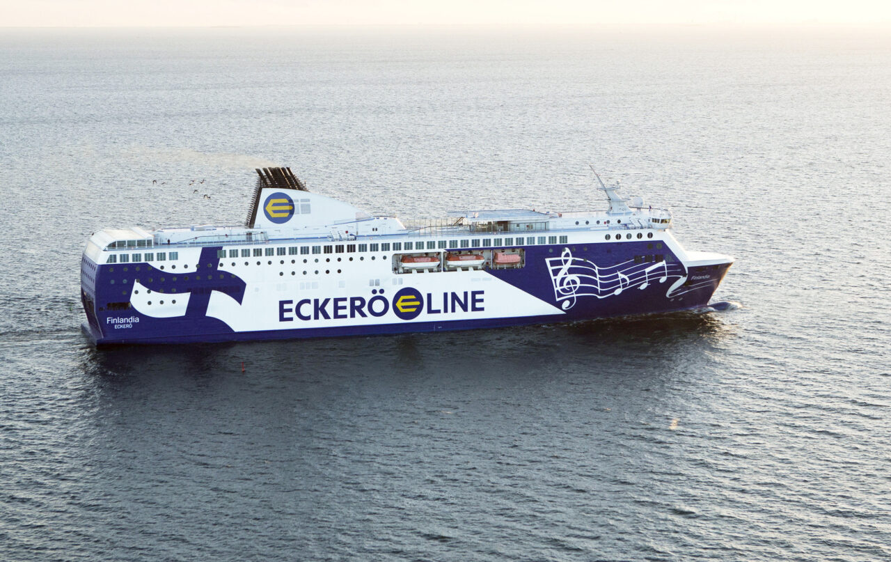 a large white and blue ship in the water