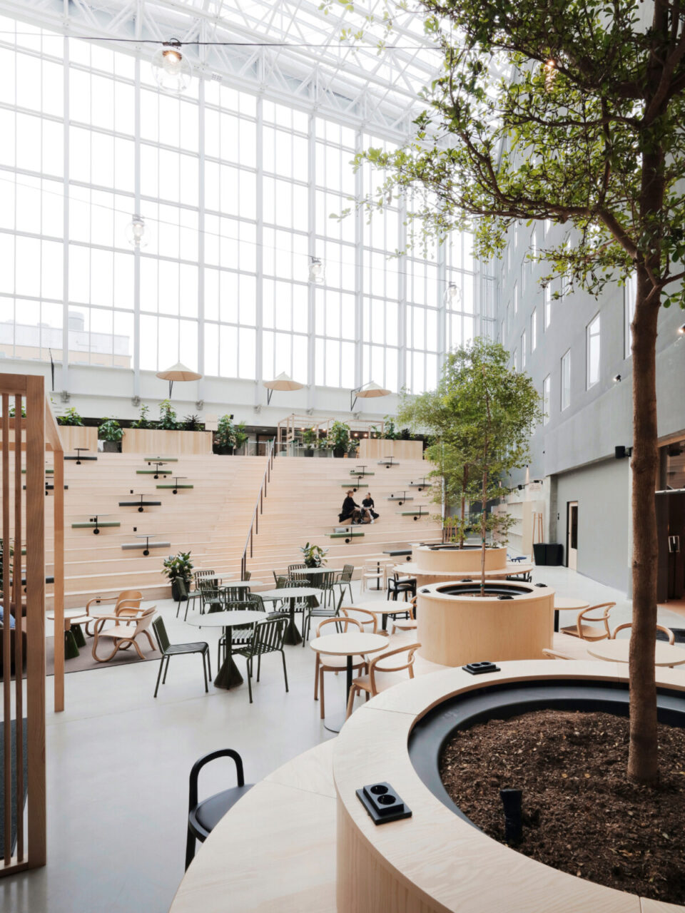a large building with many seats and tables and chairs