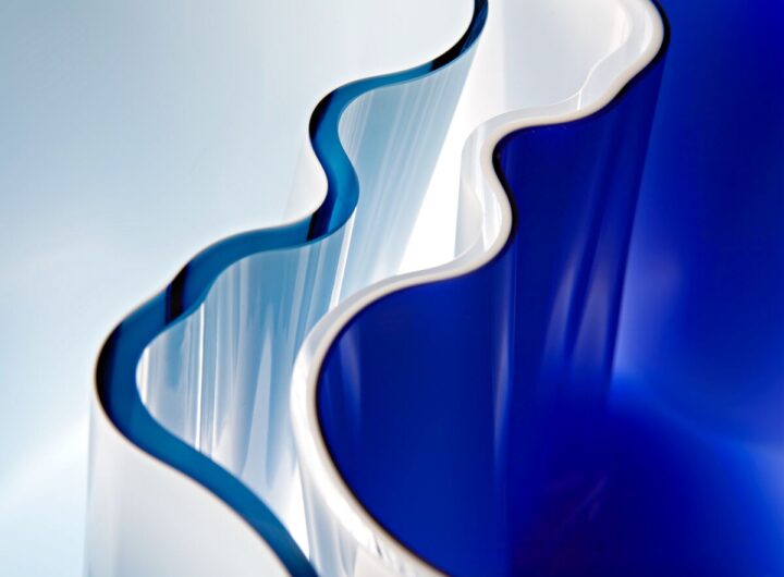 a close up of a blue and white glass from Aalto