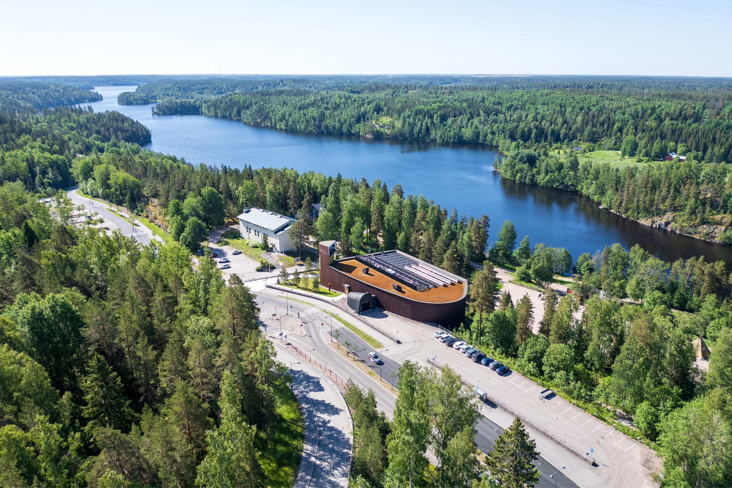 Haltia nature centre amidst forest and a lake.