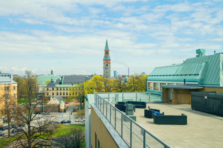 Sunny campus view with clock tower at the University of the Arts Helsinki