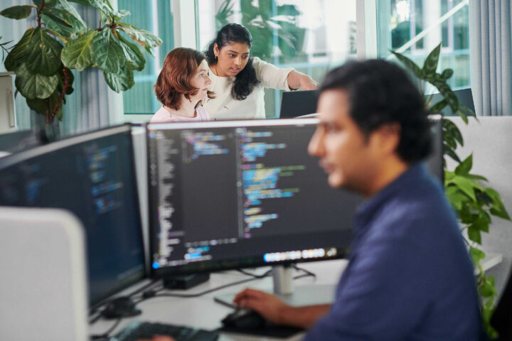 Collaborative coding in a modern workspace.