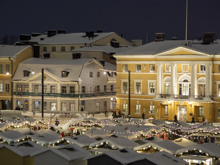 Helsinki Christmas on Senate Square market covered in snow.