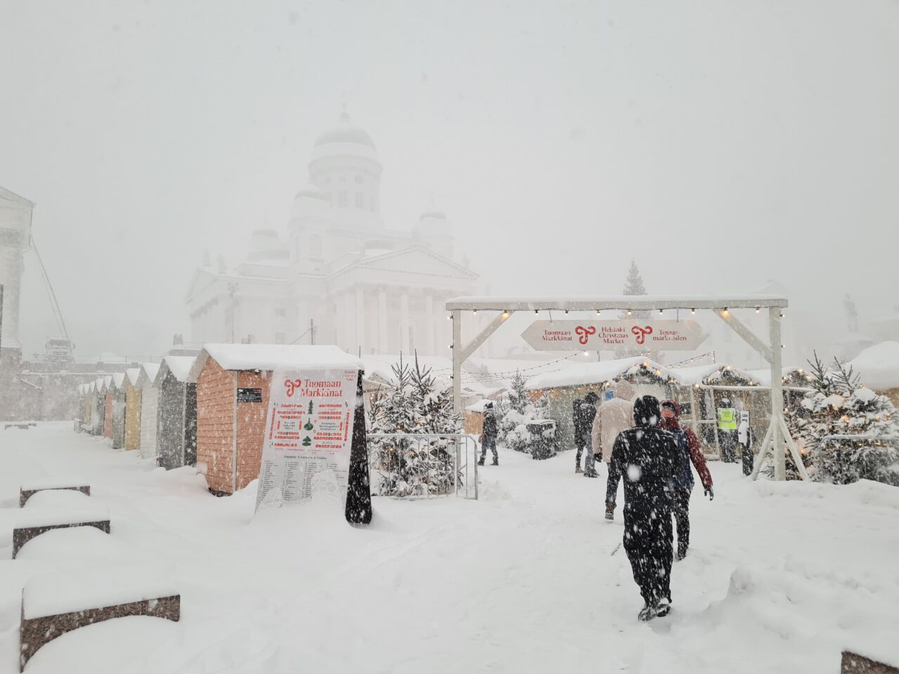 Helsinki Christmas Market in Senate Square covered in snow