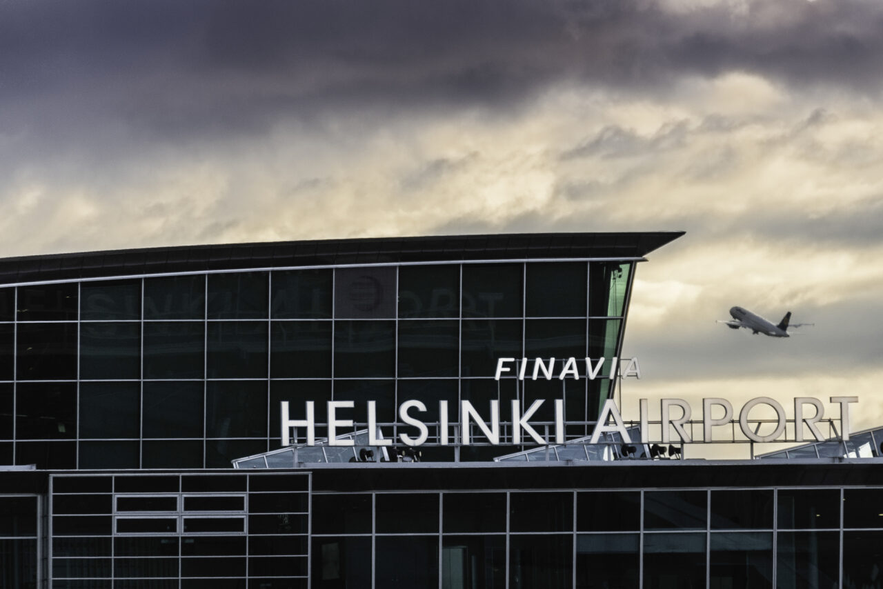 Helsinki Airport with departing aircraft.