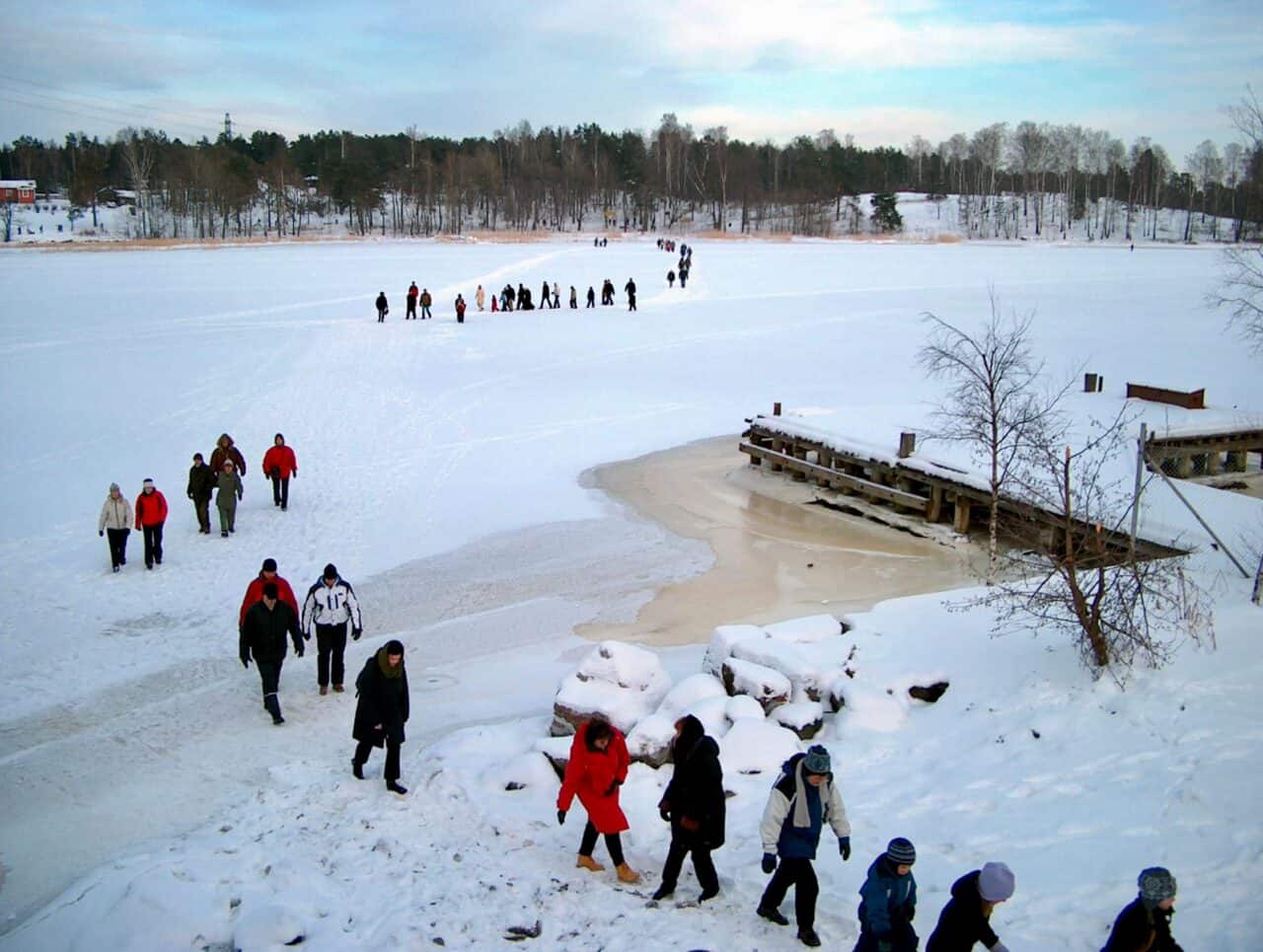 People walking on ice on Mustikkamaansalmi in Helsinki.