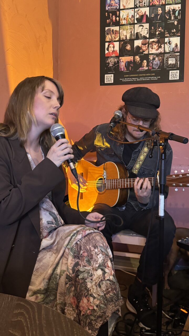 Couple playing music in Saurahuone cafe in Käpylä neighbourhood, Helsinki.