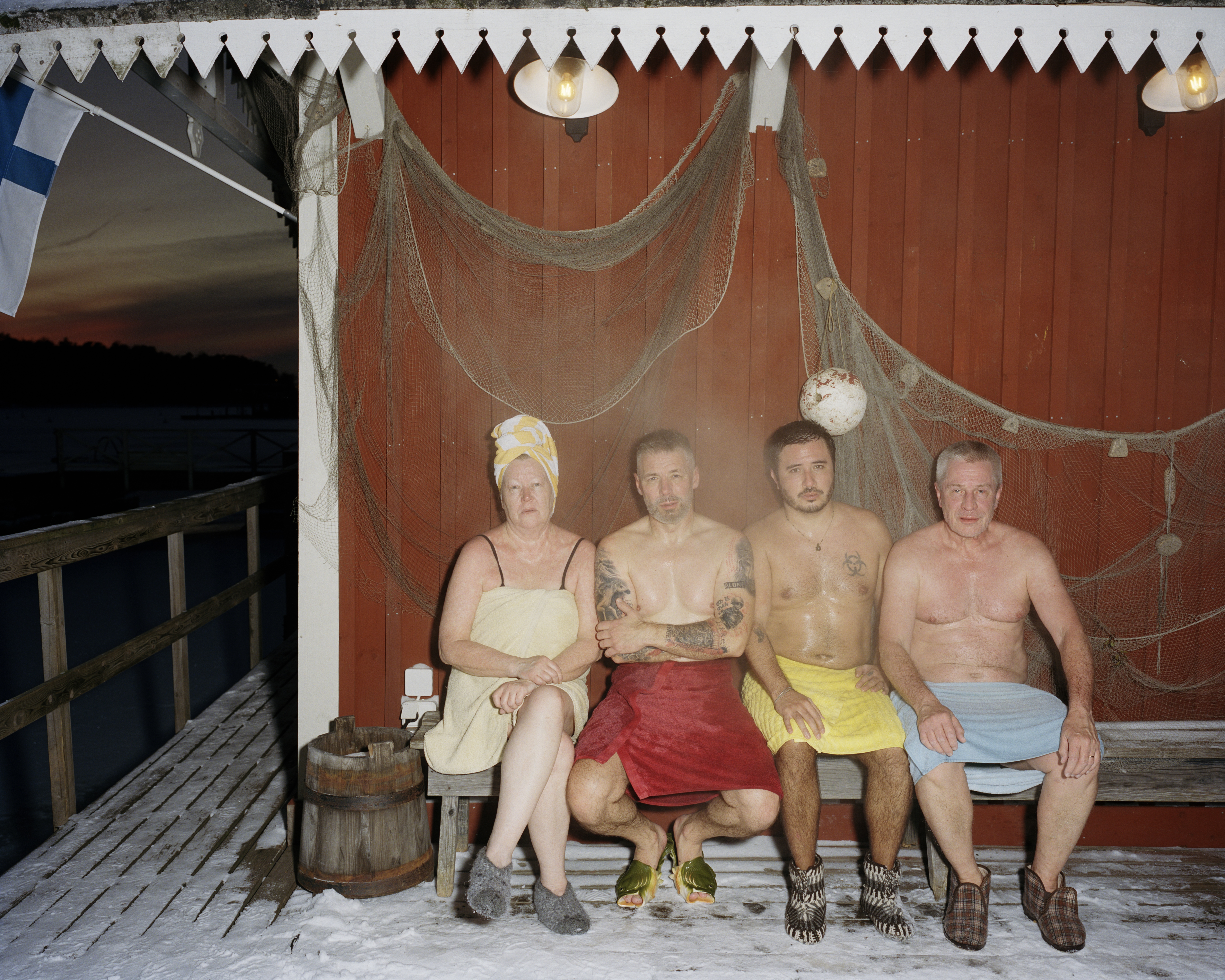 We couldn't be happier, say four people sitting on a bench outside a steaming sauna in Helsinki.