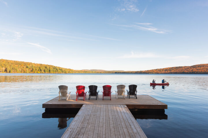 Dock with chairs by serene lake
