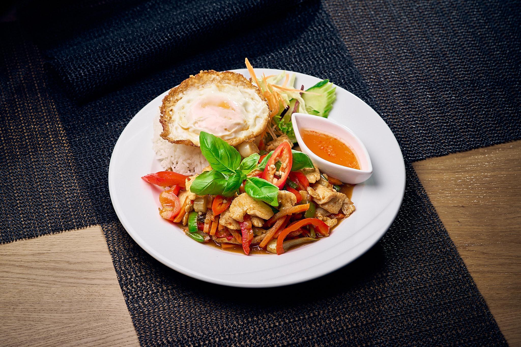 Pad Gra Prawn — stir-fried chicken with Thai basil, garlic and chili. A Thai classic at Yuwa's in Kamppi, Helsinki.