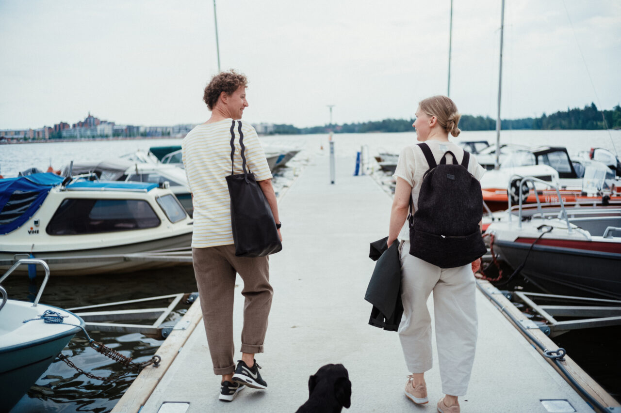Couple taking a boat to Helsinki Archipelago
